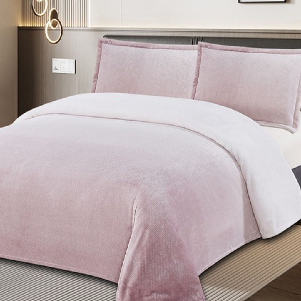 Bed with pink and white bedding in a bedroom setting