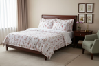 Floral patterned fabric with pink and brown flowers on a white background