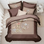 Printed bedding set with floral designs on a brown background, featuring the Rochelle France.