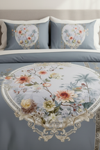 Floral embroidered bedding set on a bed with 'Nouvelles France' branding.