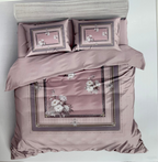 Bedding set with floral embroidery on a white background, featuring the brand 'Rochelle France'.