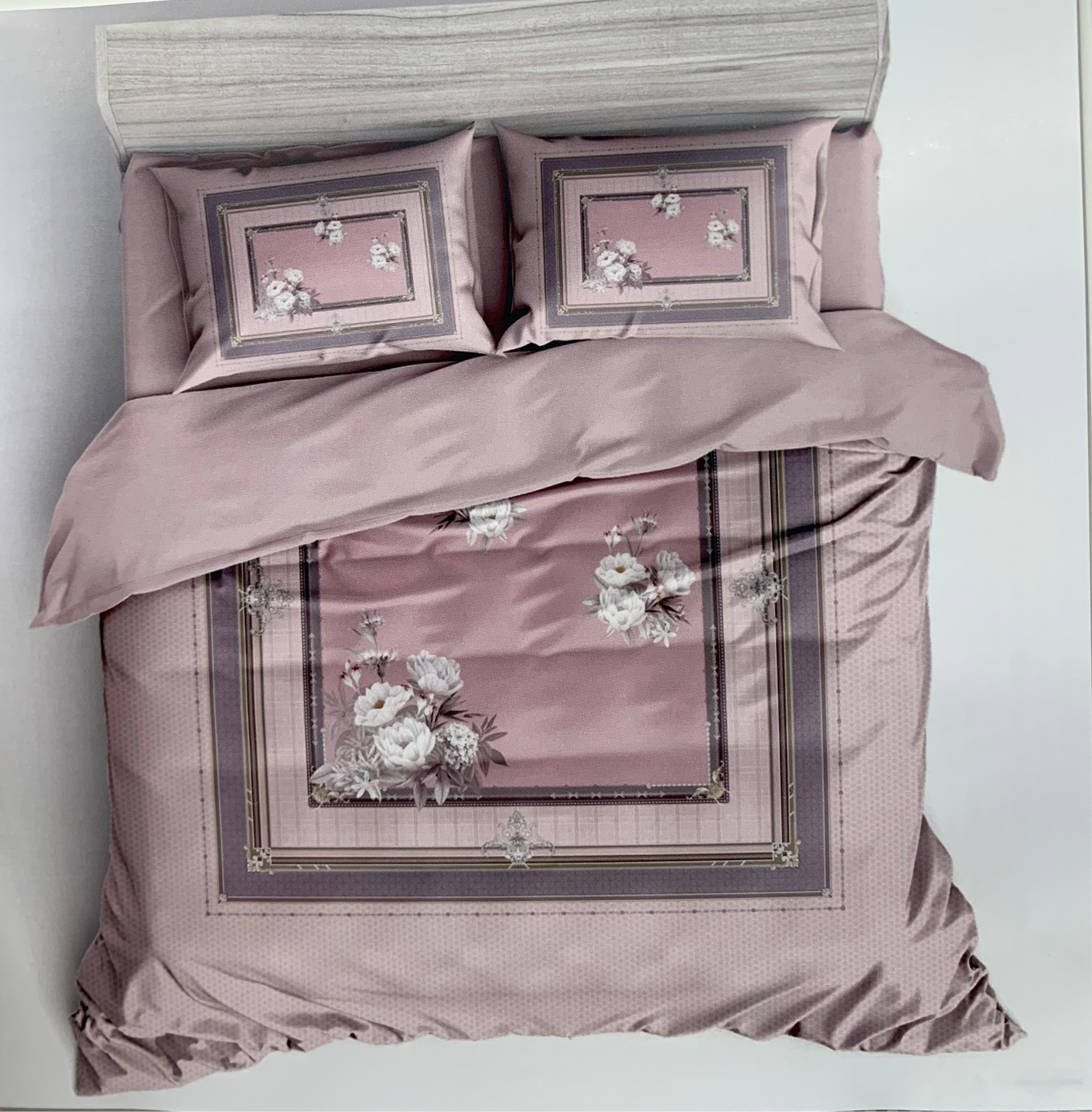 Bedding set with floral embroidery on a white background, featuring the brand 'Rochelle France'.