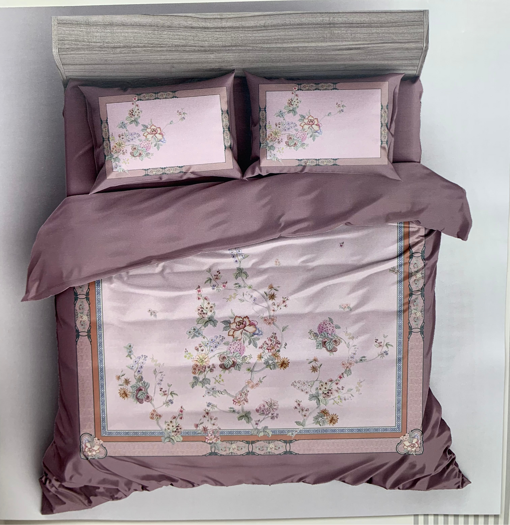 Bedding set with floral patterns and 'Rochelle France' branding on a white background