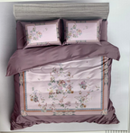 Bedding set with floral patterns and 'Rochelle France' branding on a white background