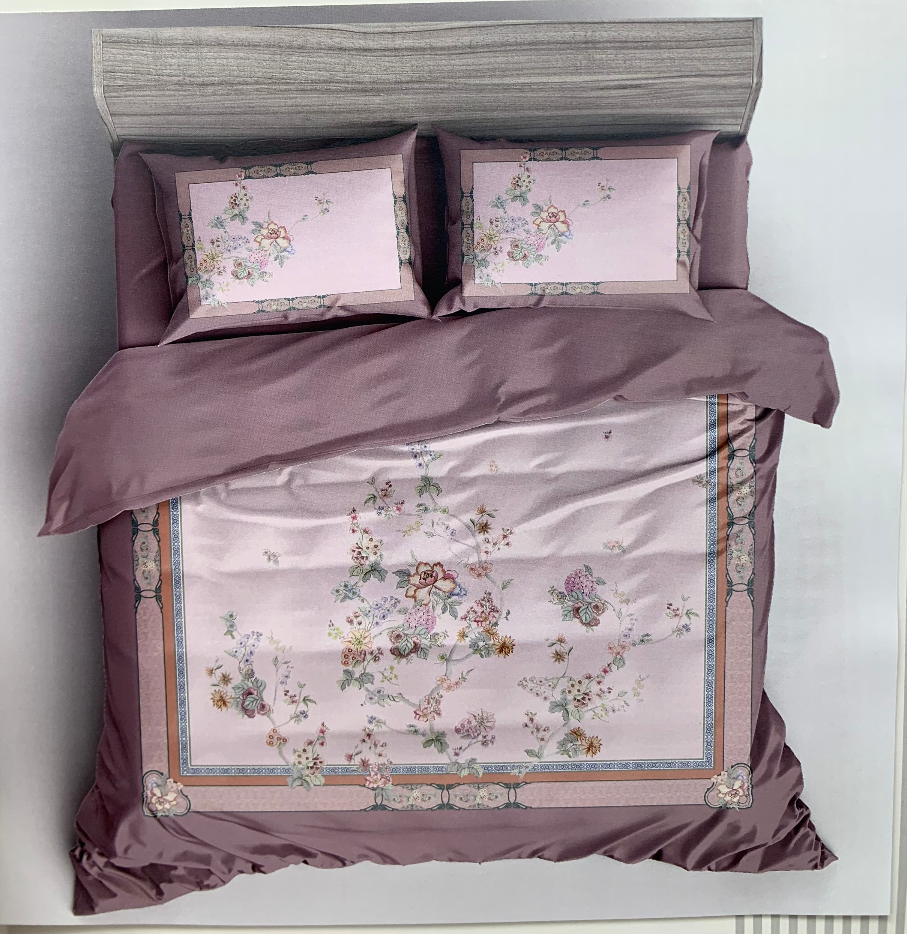 Bedding set with floral patterns and 'Rochelle France' branding on a white background
