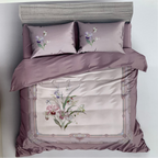 Floral embroidered bedding set with 'Rochelle France' branding on a white background