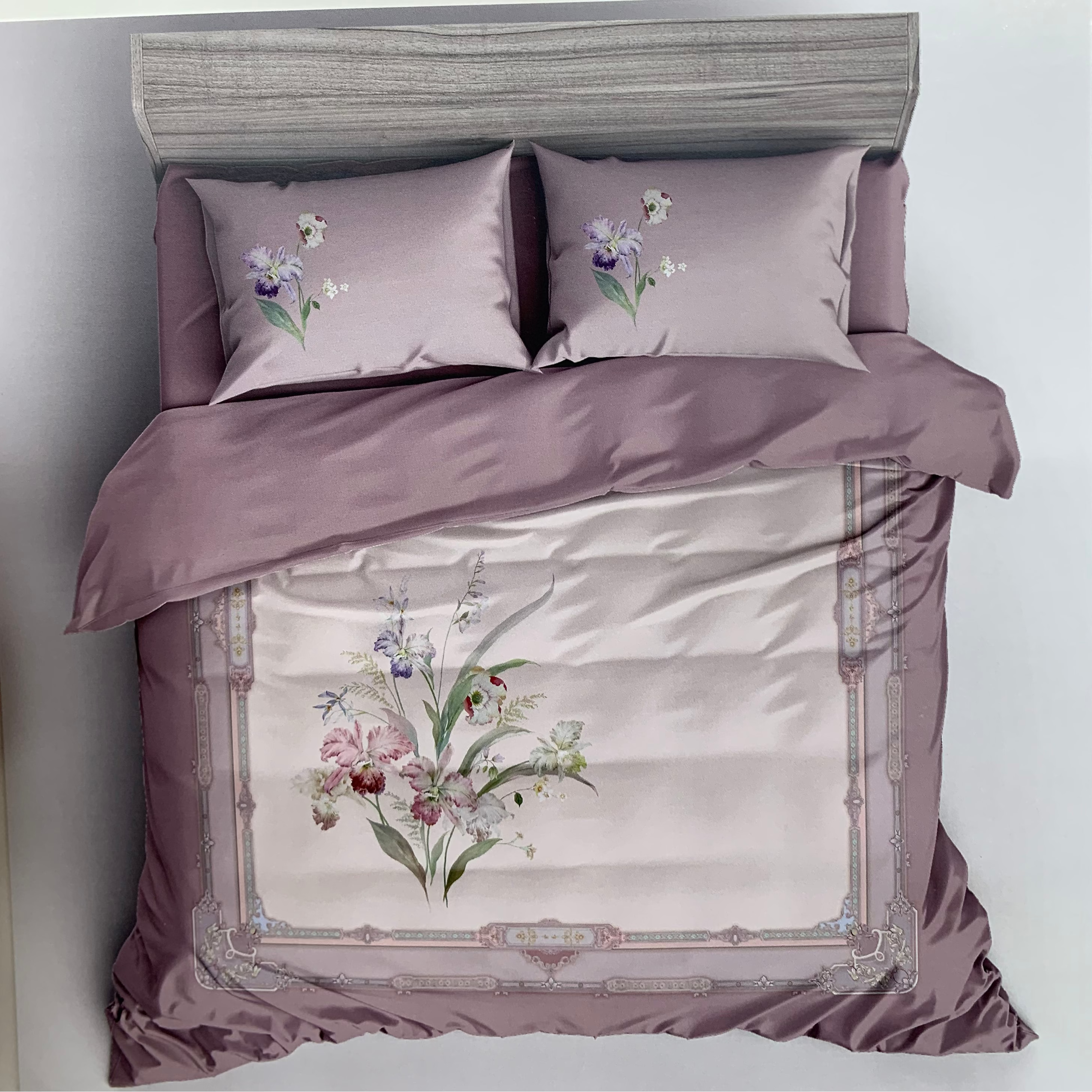 Floral embroidered bedding set with 'Rochelle France' branding on a white background