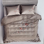 Bed with floral printed bedding and pillows, featuring the brand 'Rochelle France' on a white background.