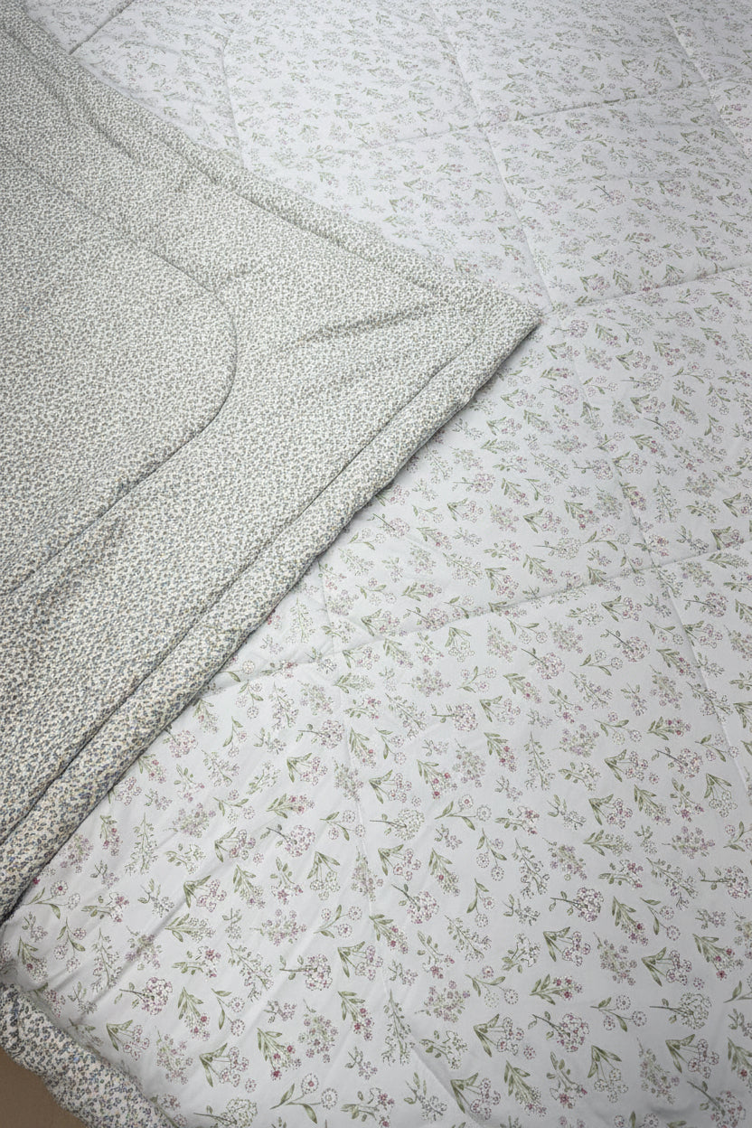 Textured fabric with a subtle pattern on a light gray background
