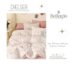 Floral comforter on a bed with 'Chelsea' and 'Bellagio' branding.