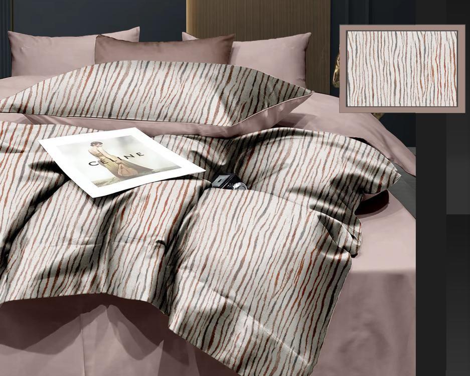 Striped bedding set on a bed with a close-up of the fabric texture in the corner.