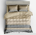 Beige and gray patterned bedding set on a bed with pillows.