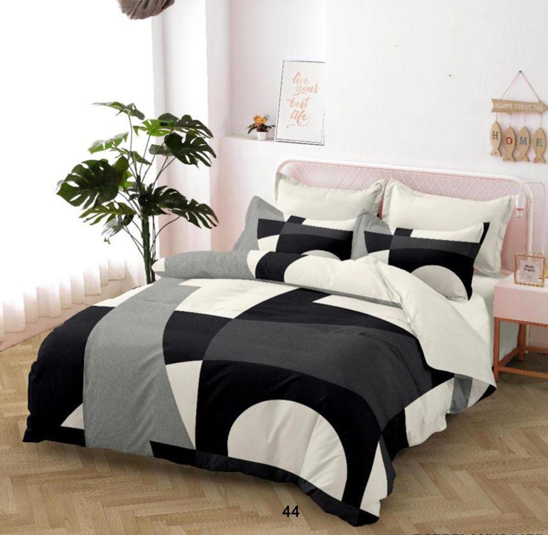 Bedroom with a bedsheet in black, white, and gray checkered bedding.